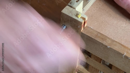 Screwing assembling a flat-pack piece of furniture up tight