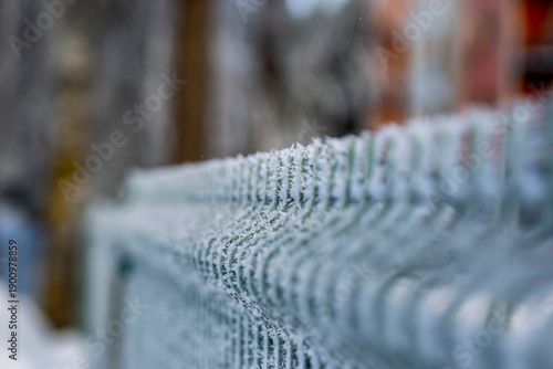 close up of snowy metal fence
