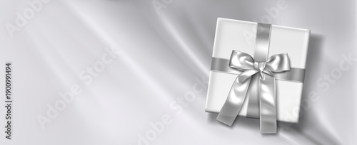 Silver silk flowing background with white gift box and satin ribbon with bow, realistic vector illustration. Elegant velvet bg, top view. Premium present banner for birthday celebration, special event