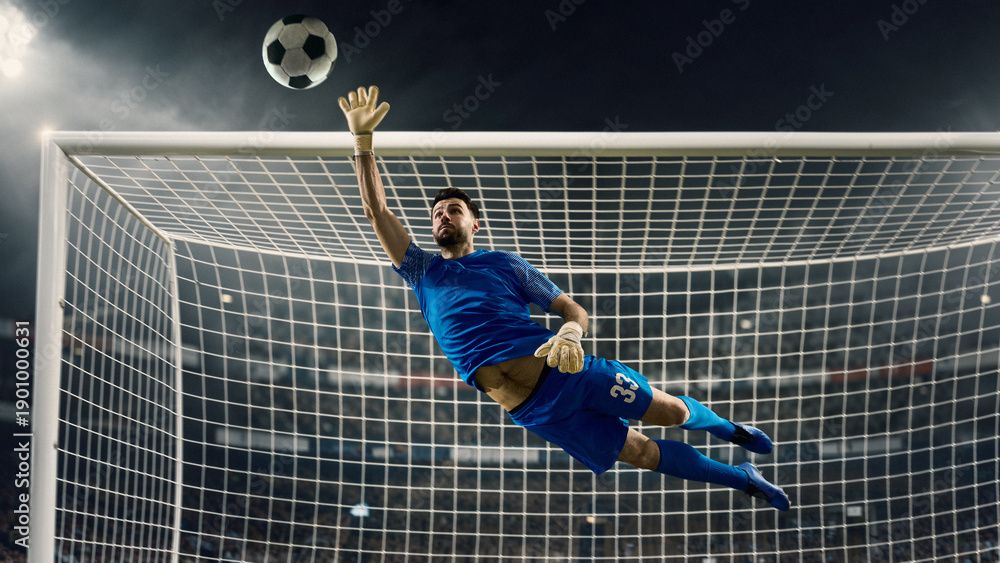 Fototapeta premium Soccer goalkeeper diving save against powerful shot on stadium field. Concept of match highlight, goal defense, professional football action, sports media, advertising, and training materials.