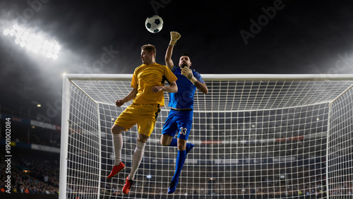 Obraz na płótnie Soccer goalkeeper and striker aerial duel near goal
