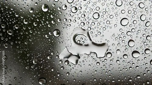 Rain Drops on Window Surface Closeup.