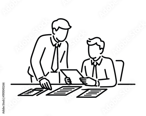 Two businessmen in formal attire collaborating over documents and a tablet during a meeting