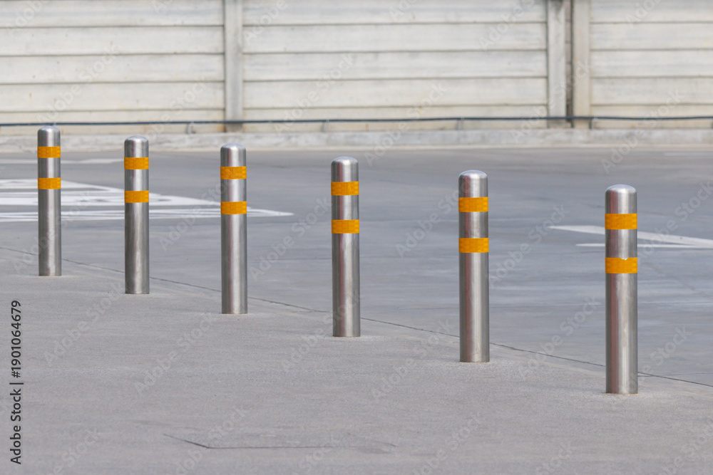 Naklejka premium stainless steel bollards on pathway.