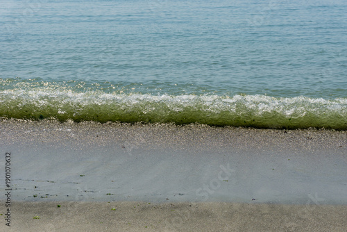 Sand and sea with waves on the beach