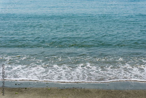 Sand and sea with waves on the beach