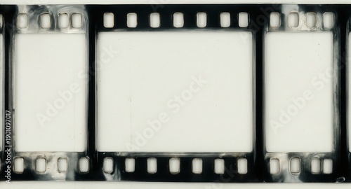 vintage 35mm film strip with empty frame for photo or text insertion