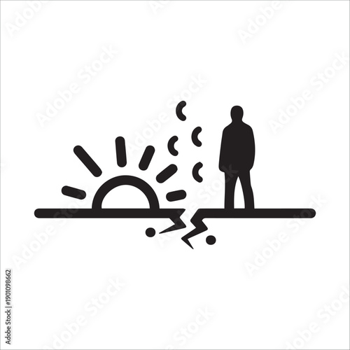 A man stands alone on the edge of a cliff at sunrise