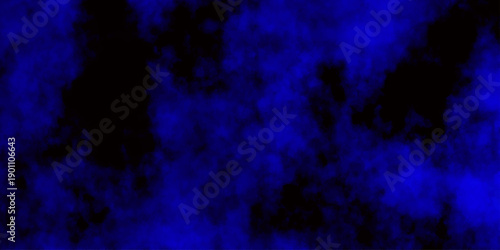 
Artificial magic smoke in black and blue light on black background in darkness. light blue and dark blue background. Black and blue Grunge Concrete Wall Texture Background.

