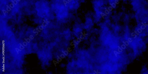 
Artificial magic smoke in black and blue light on black background in darkness. light blue and dark blue background. Black and blue Grunge Concrete Wall Texture Background.

