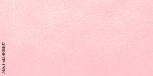 A vintage pink paper texture background features a blank pastel grunge pattern with an aged paint surface and textured material design for a scrapbook canvas backdrop