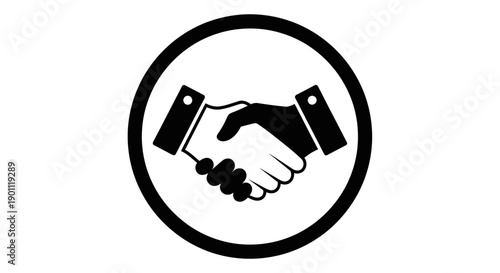 Symbol of business agreement and partnership depicted by two hands shaking inside a circle