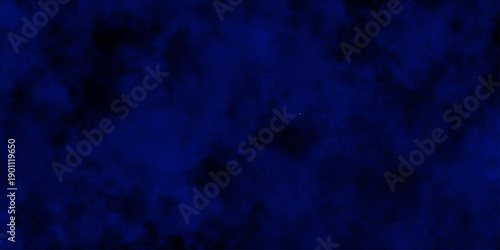 
Artificial magic smoke in black and blue light on black background in darkness. light blue and dark blue background. Black and blue Grunge Concrete Wall Texture Background.

