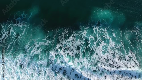 Ocean waves crashing on rocky shoreline.