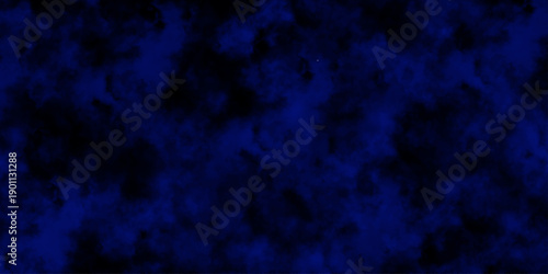 
Artificial magic smoke in black and blue light on black background in darkness. light blue and dark blue background. Black and blue Grunge Concrete Wall Texture Background.

