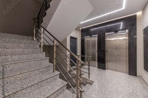 Wallpaper Mural Interior of a modern apartment building hall with staircase and two elevators. Contemporary lobby design in a new residential complex or office. Torontodigital.ca