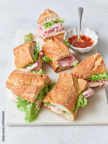 Healthy sandwiches with fresh ingredients on a table during breakfast or lunch
