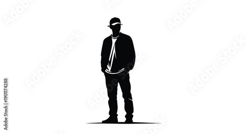 Silhouette of a man wearing a baseball cap and jacket, standing with hands in pockets.