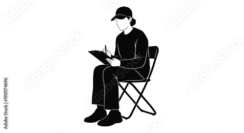 A person wearing a baseball cap and dark clothing sits on a folding chair, diligently writing on a clipboard.