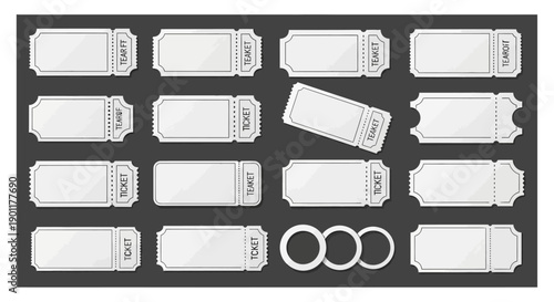 A collection of blank white tickets and rings arranged on a dark gray background.