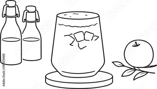 Iced Drink in Glass with Bottles and Orange