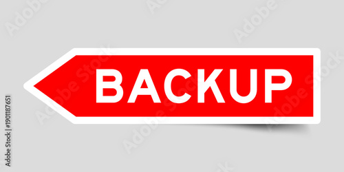 Red color arrow shape sticker label with word back up on gray background