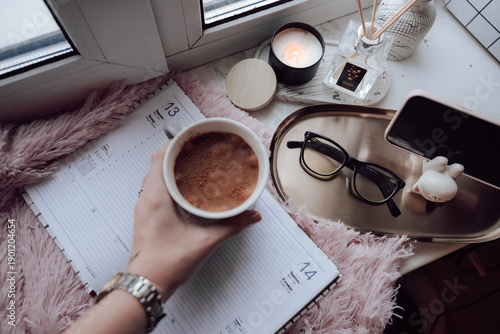 old book and glasses on wooden table