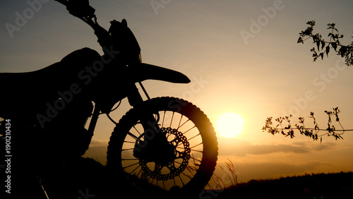 Wallpaper Mural Silhouette of a motorcycle against a stunning sunset sky, evoking feelings of freedom and adventure Torontodigital.ca