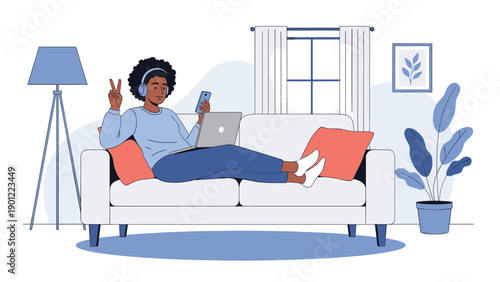 Person relaxing on a white sofa using a laptop and wearing headphones while making a peace sign in a cozy living room.