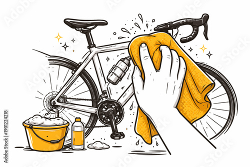 Hand cleaning bicycle with yellow cloth and soap for maintenance