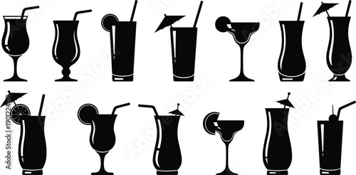 Set of black and white cocktail glasses with straws and garnishes in drink glasses cocktail set drink set