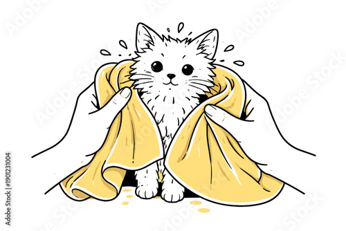 Adorable wet kitten being dried with yellow towel