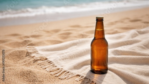 Wallpaper Mural A glass bottle of beer rests on a sandy beach, surrounded by a soft blanket, with gentle waves in the background on a sunny day. Torontodigital.ca