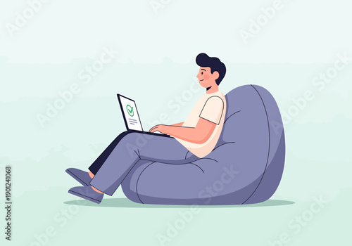 Person Using Laptop on Comfortable Beanbag Chair Working Remotely From Home Office or Cozy Space for Online Activities Developing Software or Studying