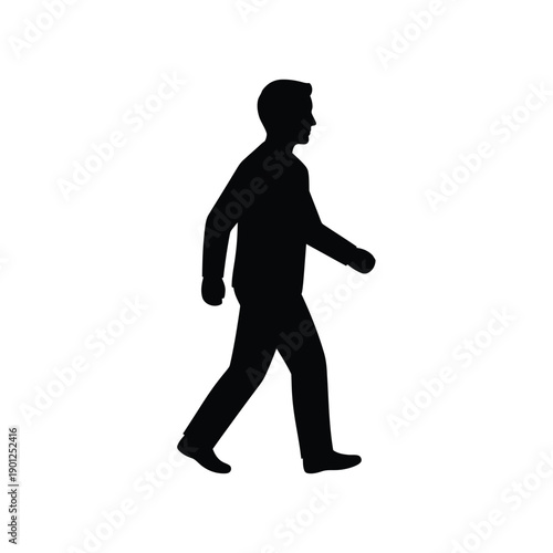 A black silhouette of a man walking alone on a in a dynamic pose
