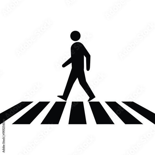 A black silhouette of a person walking across a crosswalk
