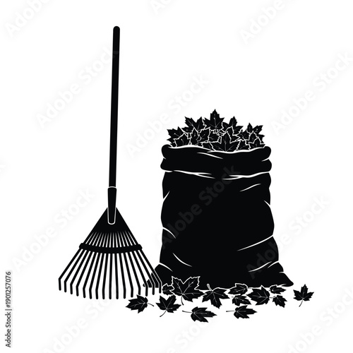 Black silhouette of a garden rake and a leaf bag on with scattered leaves
