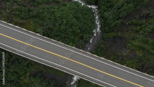 Gulch Bridge, aerial view of bridge and valley with trees and river, tilt up, Alaskan wilderness, Alaska Parks Highway Hurricane