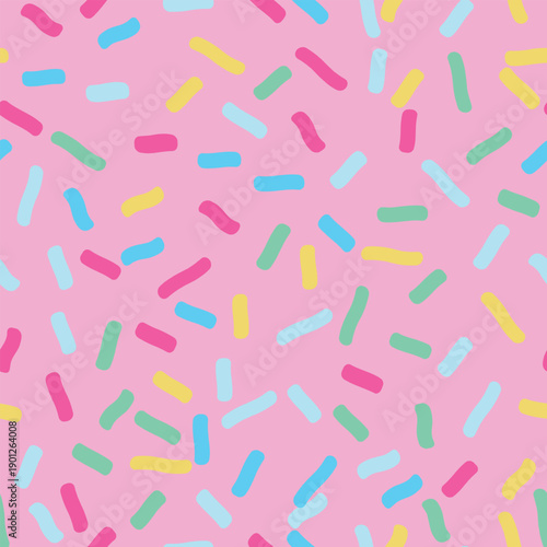 Multicolored sprinkles on pink icing seamless vector pattern. A fun print for holidays and bakeries. Cute abstract donut icing endless background.
