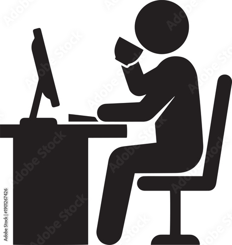 Silhouette of man working on laptop at desk in office