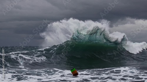 Wallpaper Mural Ocean Fury Unleashed: A colossal wave surges through the ocean under a dramatic, stormy sky, showcasing the raw, untamed power of the sea. Torontodigital.ca