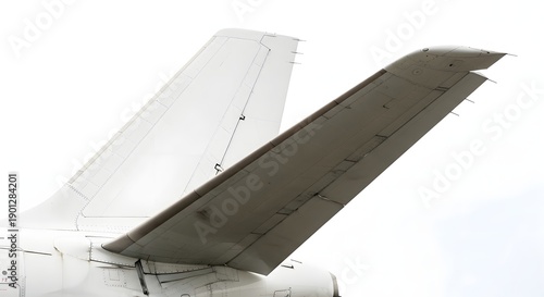 Closeup of white airplane tail with horizontal stabilizer and elevator aircraft