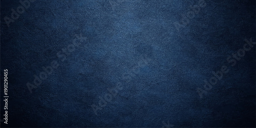 A dark blue grunge background with a textured denim fabric pattern and rough cotton textile surface for a dark material wallpaper design
