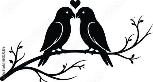 Romantic silhouette of two lovebirds perched on a leafy tree branch with a small heart symbol for wedding and valentines