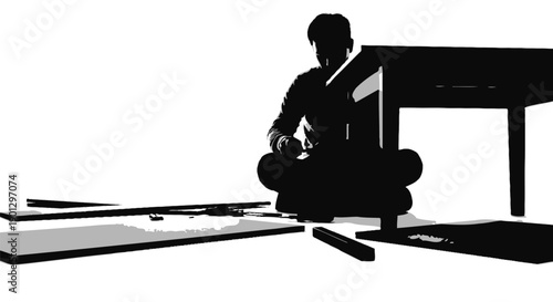 Silhouette of a person assembling flat pack furniture while sitting on the floor in a high contrast image