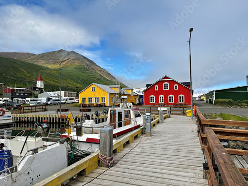 Siglufjoerdur harbor with ships and houses in Iceland in summer