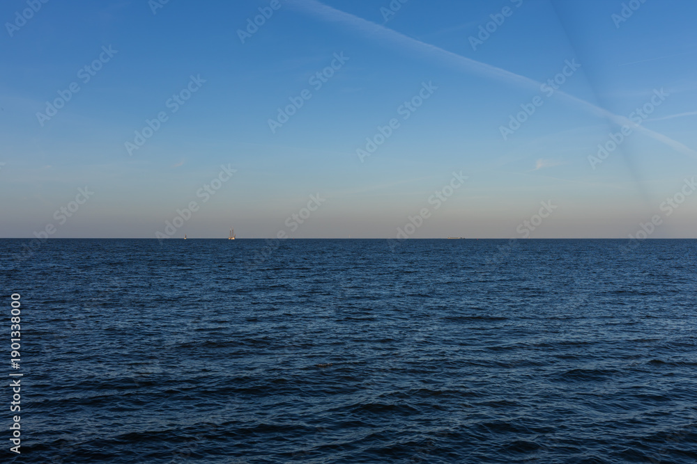 Obraz premium Traditional wooden lighthouse in Volendam at sunset, Netherlands.