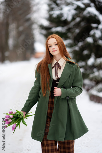 Red Haired Young Woman Holding Pink Tulips in Snowy Winter Forest, Seasonal Portrait