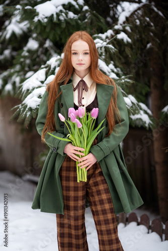 Red Haired Young Woman Holding Pink Tulips in Snowy Winter Forest, Seasonal Portrait
