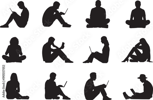 people sitting on floor with laptops and tablets